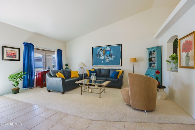 tiled living room featuring lofted ceiling