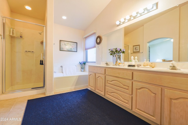 bathroom featuring lofted ceiling, shower with separate bathtub, tile patterned flooring, and vanity