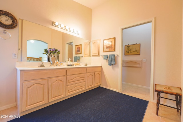 bathroom with vanity and tile patterned flooring