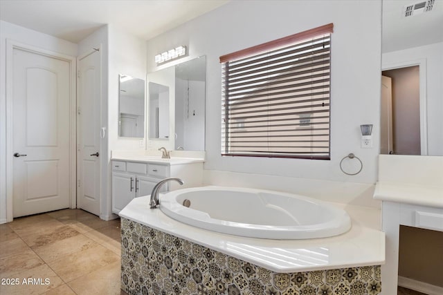 12943 W Mclellan Rd, Glendale, AZ 85307 - bathroom with tile patterned floors, visible vents, a garden tub, and vanity