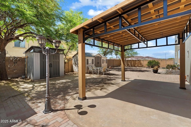 12943 W Mclellan Rd, Glendale, AZ 85307 - view of patio with an outdoor structure, a storage unit, and a fenced backyard