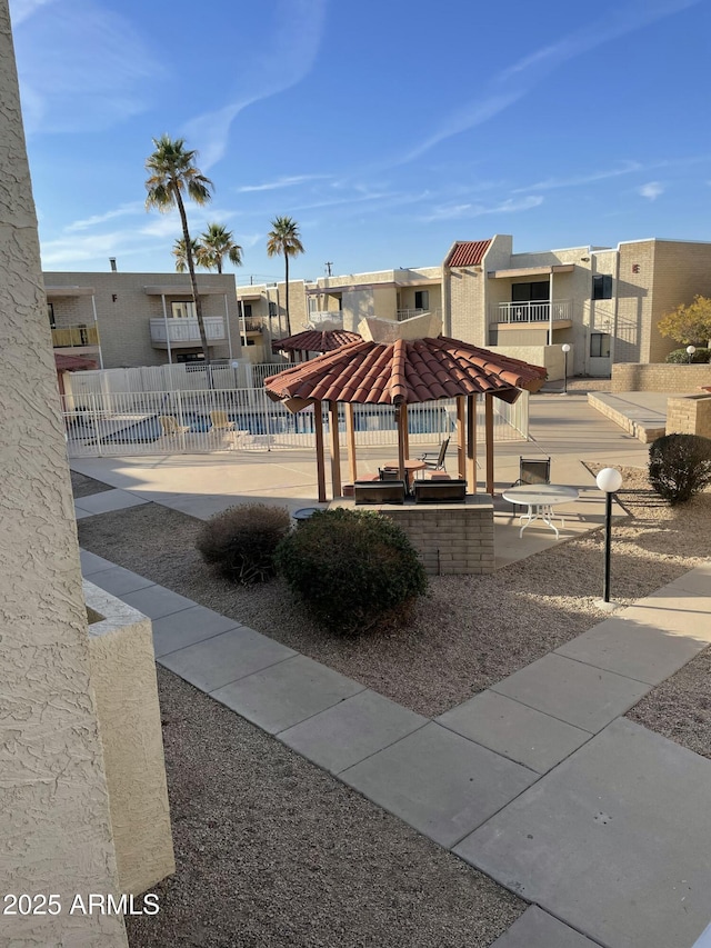 surrounding community featuring a residential view and fence