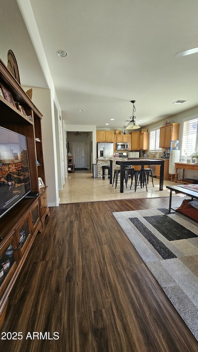 living area featuring recessed lighting and wood finished floors