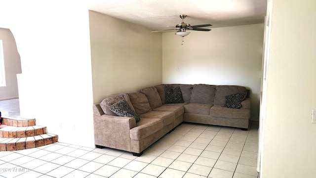 living room featuring ceiling fan and light tile patterned floors