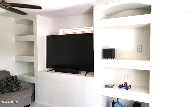 tiled living room featuring ceiling fan