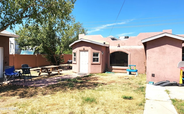 rear view of house featuring a patio area