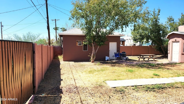 view of yard featuring an outbuilding and a fenced backyard