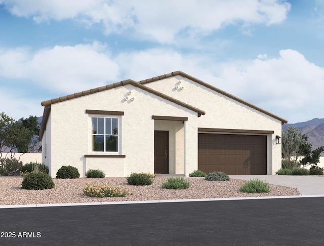 view of front of property with a garage, driveway, a mountain view, and stucco siding