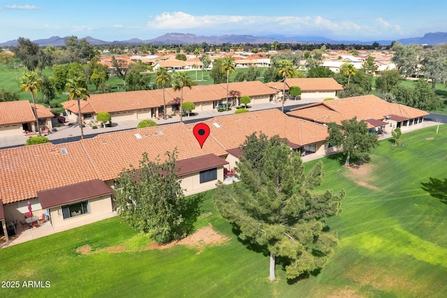 drone / aerial view featuring a residential view and a mountain view