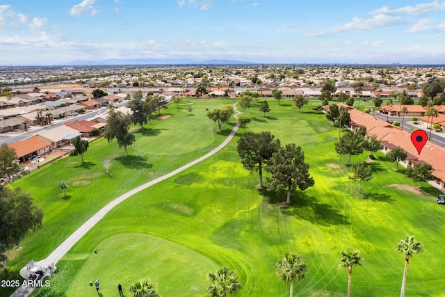 drone / aerial view with golf course view and a residential view