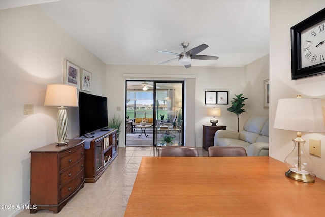 living room with light tile patterned floors and a ceiling fan