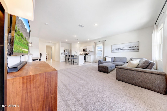 4911 N 193rd Ave, Litchfield Park, AZ 85340 - living room with light colored carpet and recessed lighting