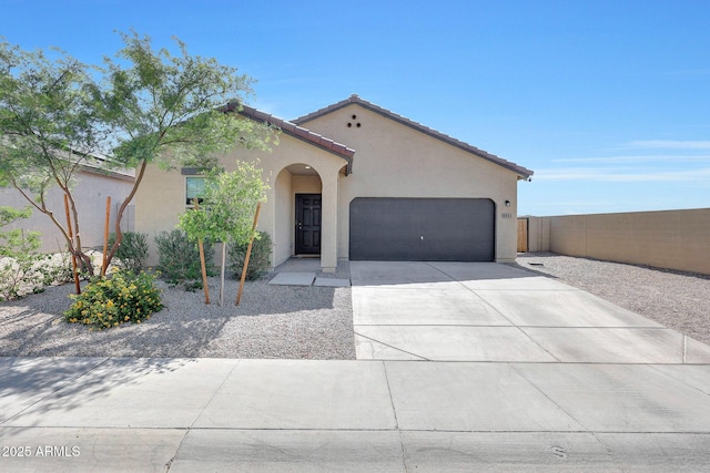 4911 N 193rd Ave, Litchfield Park, AZ 85340 - mediterranean / spanish house with a garage, stucco siding, concrete driveway, and a tile roof