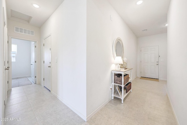 4911 N 193rd Ave, Litchfield Park, AZ 85340 - corridor featuring light tile patterned floors, recessed lighting, baseboards, and attic access