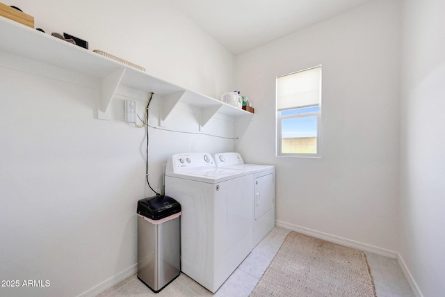 4911 N 193rd Ave, Litchfield Park, AZ 85340 - washroom featuring washer and clothes dryer, baseboards, and light tile patterned floors