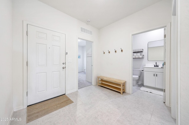 4911 N 193rd Ave, Litchfield Park, AZ 85340 - entryway featuring light tile patterned floors and baseboards