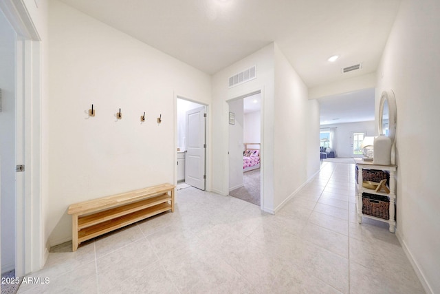 4911 N 193rd Ave, Litchfield Park, AZ 85340 - corridor featuring light tile patterned floors and baseboards