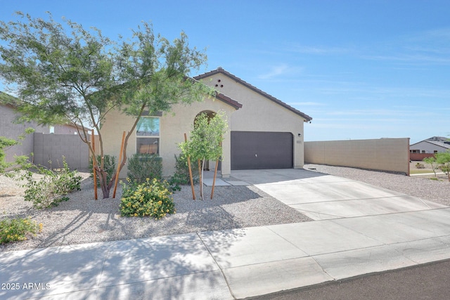4911 N 193rd Ave, Litchfield Park, AZ 85340 - mediterranean / spanish house with stucco siding, concrete driveway, and a garage