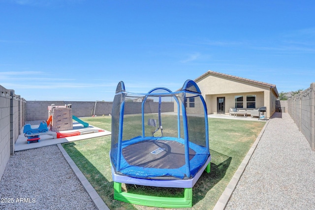 4911 N 193rd Ave, Litchfield Park, AZ 85340 - view of yard featuring a trampoline, a playground, and a patio
