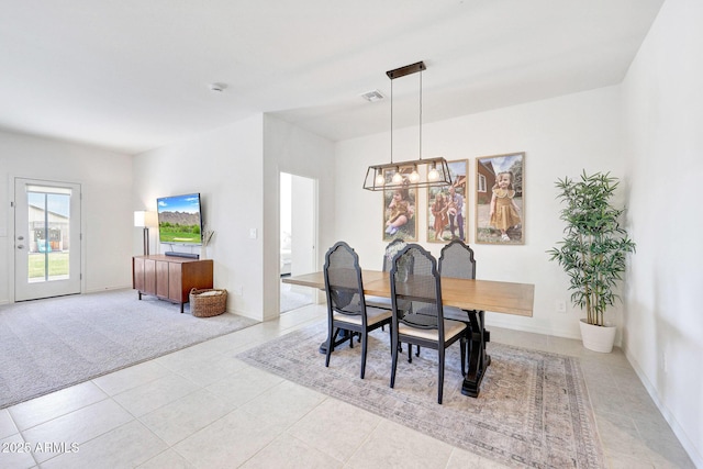4911 N 193rd Ave, Litchfield Park, AZ 85340 - dining area with a chandelier, light tile patterned flooring, and baseboards