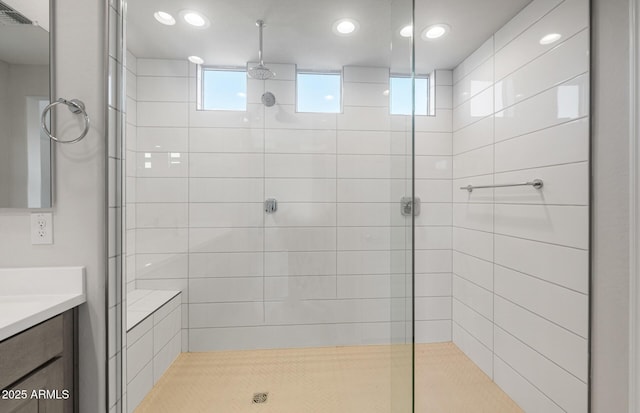 bathroom featuring a stall shower, visible vents, and vanity