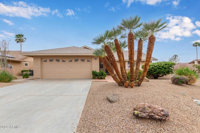 9845 W Behrend Dr, Peoria, AZ 85382 - view of front facade featuring driveway, a garage, and stucco siding