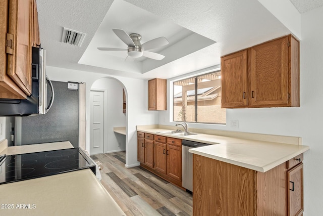 9845 W Behrend Dr, Peoria, AZ 85382 - kitchen featuring a tray ceiling, a sink, dishwasher, visible vents, and ceiling fan