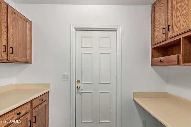 9845 W Behrend Dr, Peoria, AZ 85382 - kitchen with light countertops and brown cabinetry
