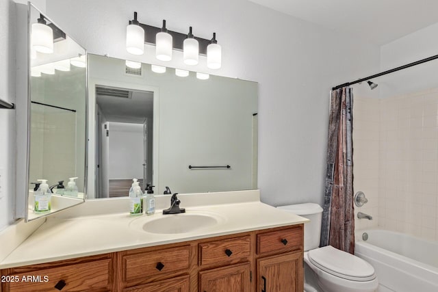9845 W Behrend Dr, Peoria, AZ 85382 - bathroom featuring shower / bath combo, visible vents, toilet, and vanity