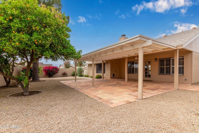 9845 W Behrend Dr, Peoria, AZ 85382 - back of property with a chimney, fence, and a patio area
