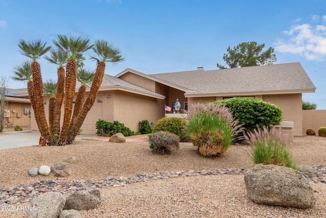 9845 W Behrend Dr, Peoria, AZ 85382 - view of front of property with roof with shingles, stucco siding, an attached garage, and concrete driveway