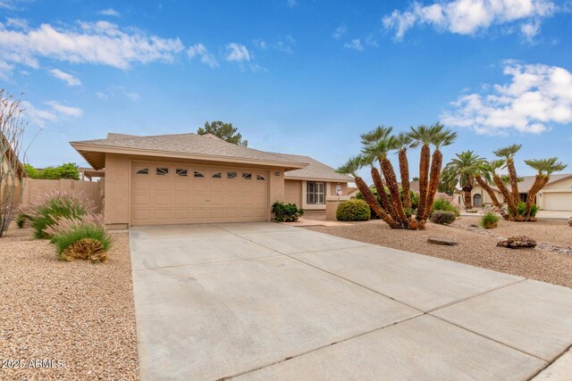 9845 W Behrend Dr, Peoria, AZ 85382 - single story home featuring a garage, driveway, stucco siding, and fence