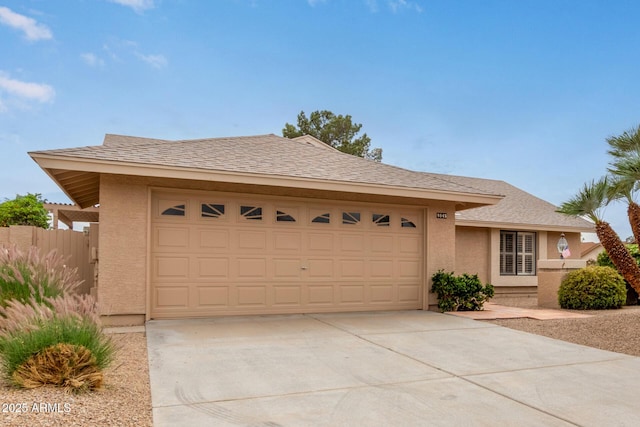 9845 W Behrend Dr, Peoria, AZ 85382 - ranch-style house with driveway, stucco siding, fence, a shingled roof, and a garage
