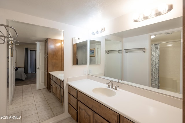 bathroom featuring tile patterned floors and vanity