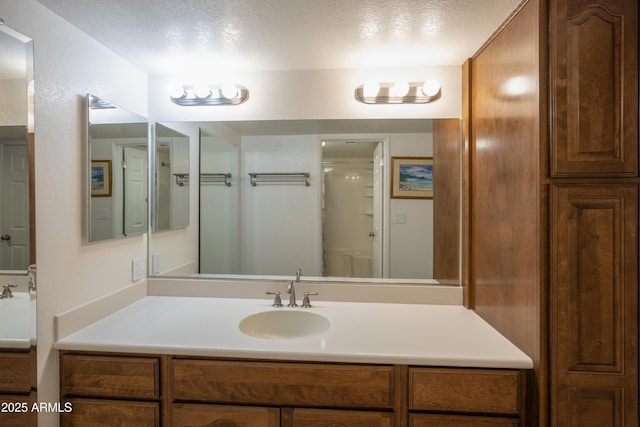 bathroom featuring vanity and a textured ceiling