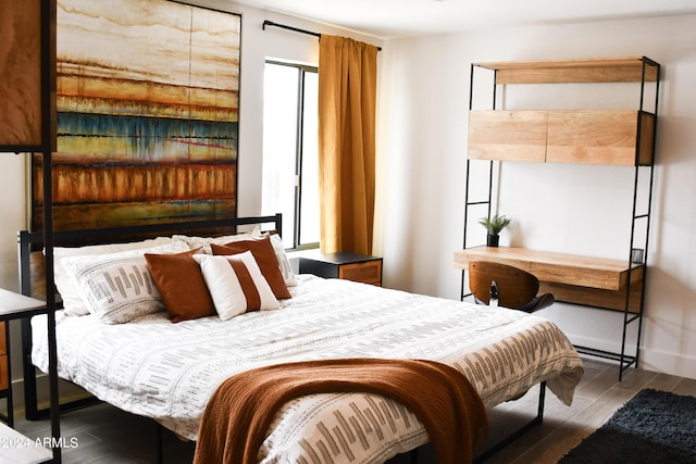 bedroom with wood-type flooring