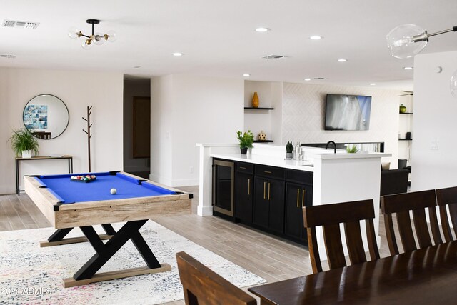 recreation room featuring pool table, beverage cooler, and light hardwood / wood-style floors