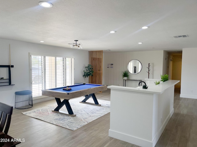 game room featuring wood-type flooring and billiards