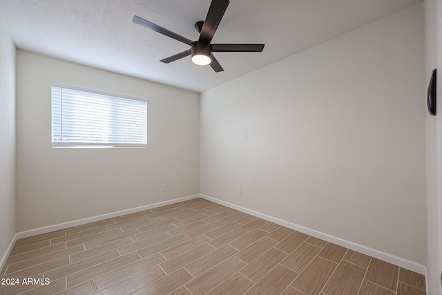 unfurnished room featuring ceiling fan