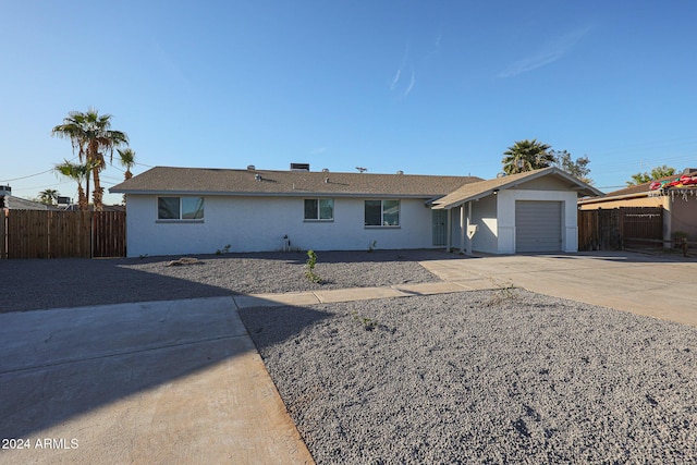 single story home featuring a garage