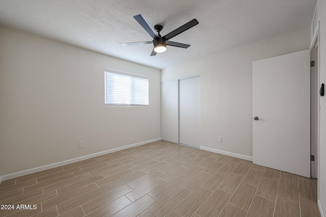 unfurnished room with ceiling fan