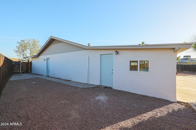 back of property with a patio area