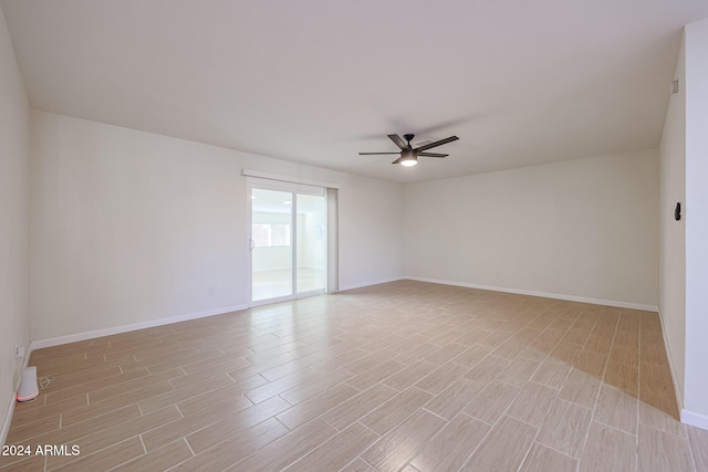 unfurnished room featuring ceiling fan and light wood-type flooring