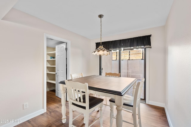 dining area featuring hardwood / wood-style floors