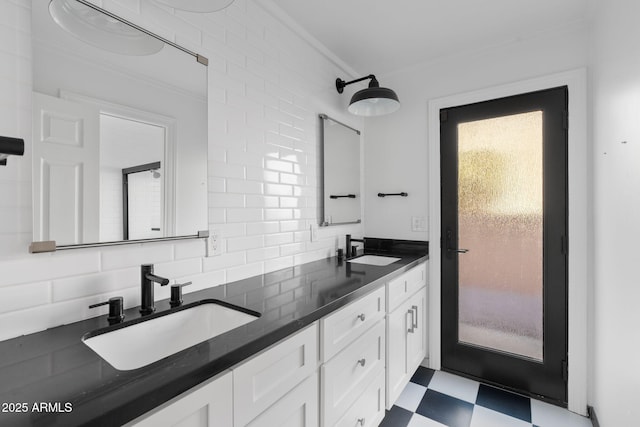 bathroom with tasteful backsplash, vanity, and crown molding