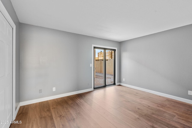 empty room featuring wood-type flooring