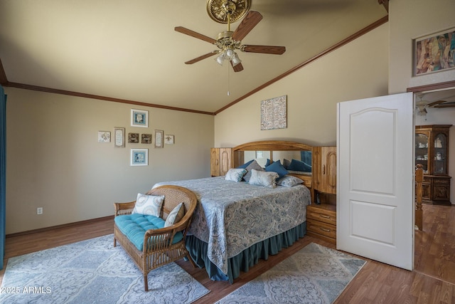 bedroom with ornamental molding, ceiling fan, and wood finished floors