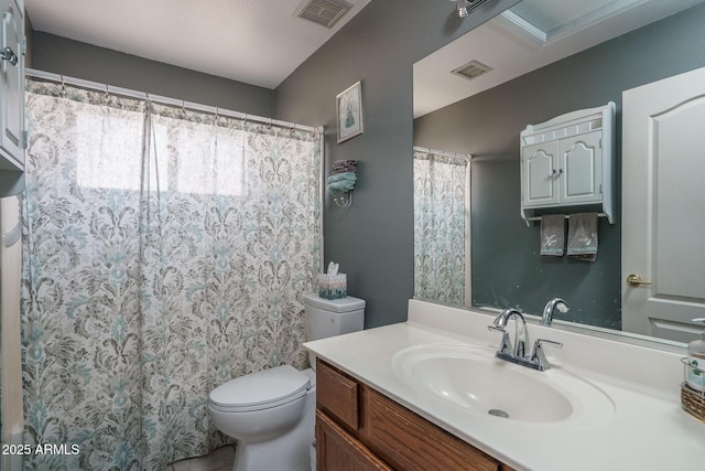 full bathroom featuring vanity, toilet, and visible vents