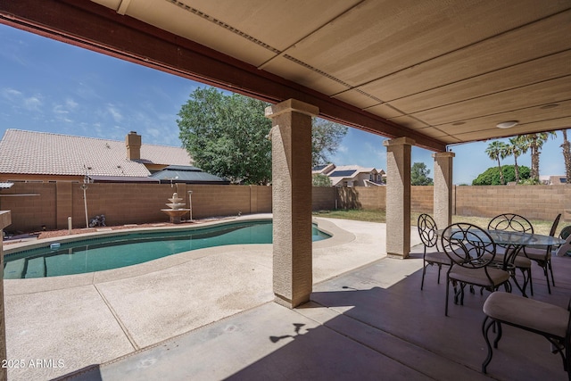 view of swimming pool featuring a fenced backyard, a fenced in pool, outdoor dining area, and a patio area