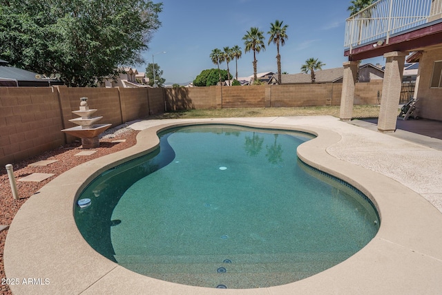 view of swimming pool with a fenced in pool, a fenced backyard, and a patio area